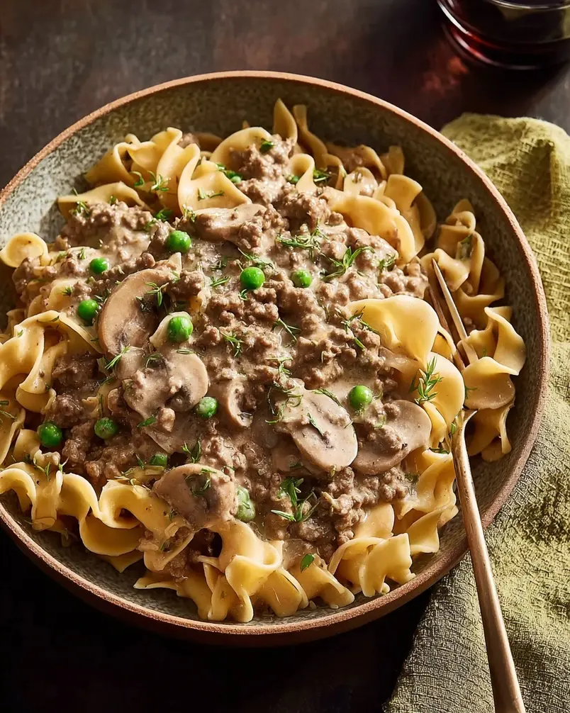Ground Beef Stroganoff 2 Recipe preparation image: Ground beef, mushrooms, and onions ready for cooking.